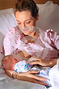 Happy Mom Nursing Newborn Baby
