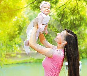 Happy mom playing with child