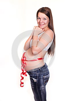 Happy mom's tummy tied up by a gift tape