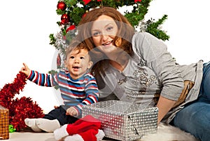 Happy mom and son celebrate first Christmas