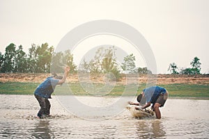 Happy moment Asian children playing water in outdoor