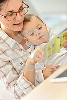 Happy moment for baby listening to mother's story