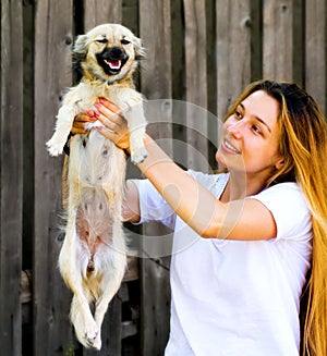 Happy moment - cute woman and her funny dog