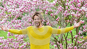 Happy moments. fresh blossom flower. sexy guy blooming flower tree. spring fashion style. Male sexuality. sakura