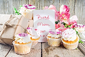 Happy moms day background with cupcakes