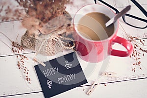 Happy Monday massage on notebook with coffee