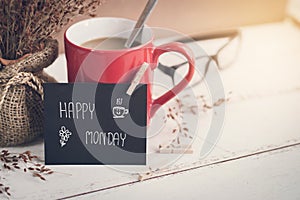 Happy Monday massage on notebook with coffee