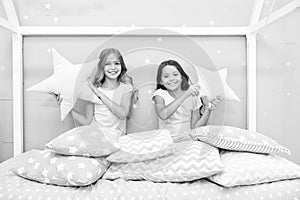 Happy morning. Cute cozy bedroom for small girls. Sisters having fun bedroom interior. Childhood concept. Bedroom place
