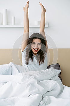 happy morning fresh start enthusiastic woman bed