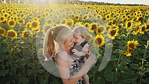 Happy mother and baby kissing and hugging