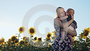 Happy mother and baby kissing and hugging