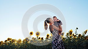 Happy mother and baby kissing and hugging