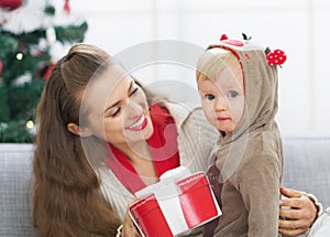 Happy mother and baby spending christmas time together