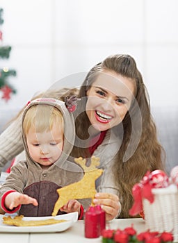 Happy mother and baby spending christmas time together