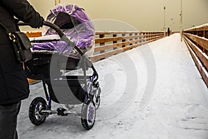 Happy Mother with Baby Stroller Walking near the sea shore and E