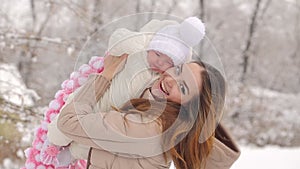 Happy Mother with Baby in Winter