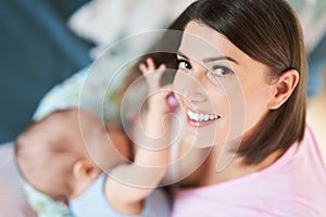 Happy Mother breastfeeding Newborn Baby