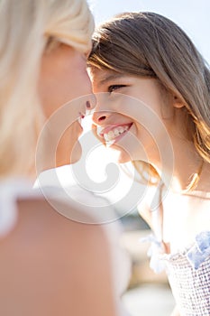 Happy mother and child girl outdoors