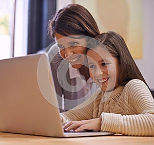 Happy mother, child and learning with laptop for support, care or browsing on social media at home. Mother, daughter or