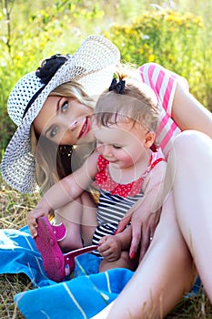 A happy mother with a child in nature