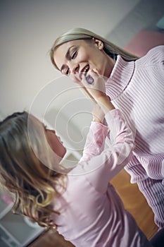 Happy mother and daughter at home.