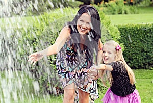 Happy mother and daughter in park