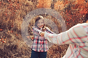 Happy mother and daughter on the walk on summer field. Family spending vacation outdoor, lifestyle capture