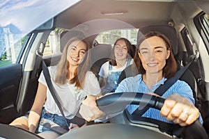 Happy mother and daughters during road trip