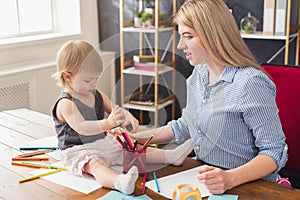 Happy mother drawing with her daughter