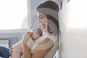happy mother with her baby girl at home. Lifestyle indoors and family love concept