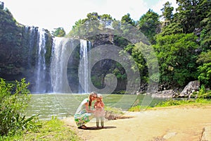 Happy mother with her daughter outdoors. Whangarei Falls, New Zealand