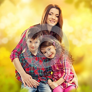 Happy mother with her daughter and son