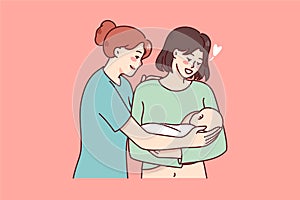 Happy mother holding newborn baby in arms