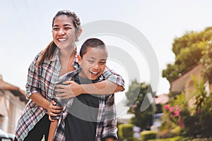 Happy mother hug son or pupil with backpack before they go to school, Back to school concept, Selective focus