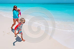 happy mother and kids enjoy beach vacation, family have fun