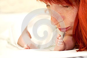 Happy mother kissing newborn baby