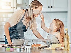 Happy mother in kitchen, bake together with child and flour, playing and learning with woman. Love, mom and girl kid