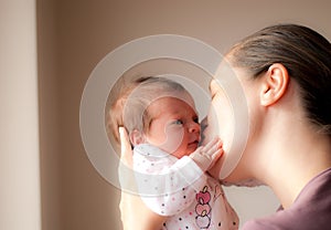 Happy mother with little baby