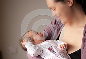 Happy mother with little baby