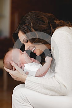 Happy mother with newborn baby