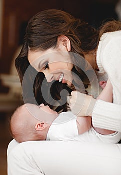 Happy mother with newborn baby