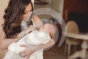 Happy mother with newborn baby