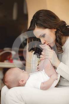 Happy mother with newborn baby