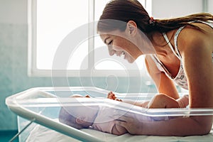 Happy mother with newborn baby in hospital