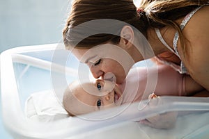 Happy mother with newborn baby in hospital