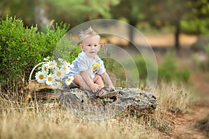 Happy mother playing with her son in the park