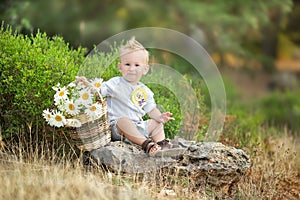 Happy mother playing with her son in the park