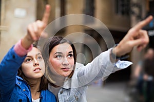 Happy mother pointing to daughter new sight