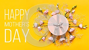 Happy Mother`s Day Background. Bright Yellow and Pastel Pink Colored Mother Day Background. Flat lay greeting card.