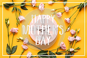 Happy Mother`s Day Background. Bright Yellow and Pastel Pink Colored Mother Day Background. Flat lay greeting card with gift box.